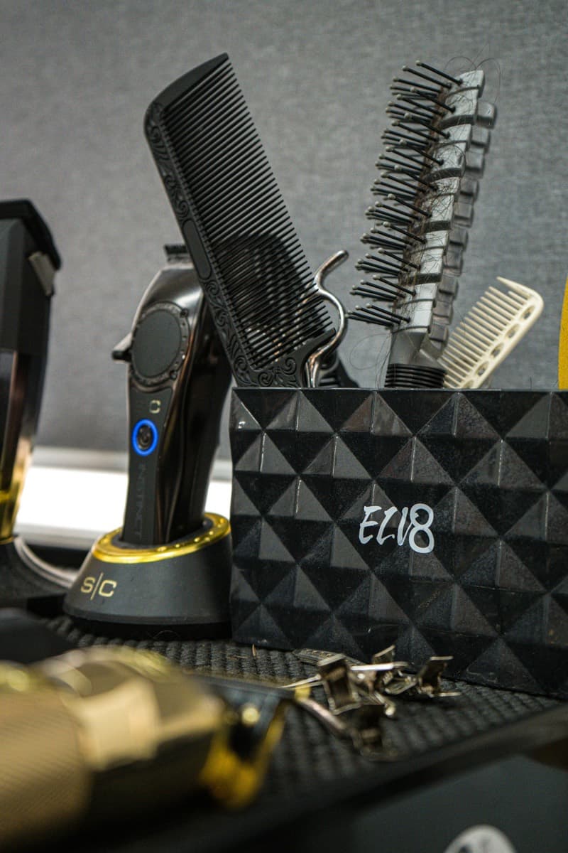 Clippers, combs and shears in a barber's station